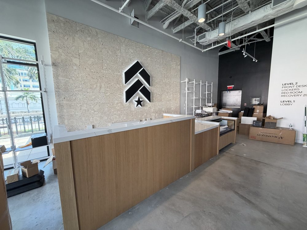Commercial reception desk with a stone feature wall