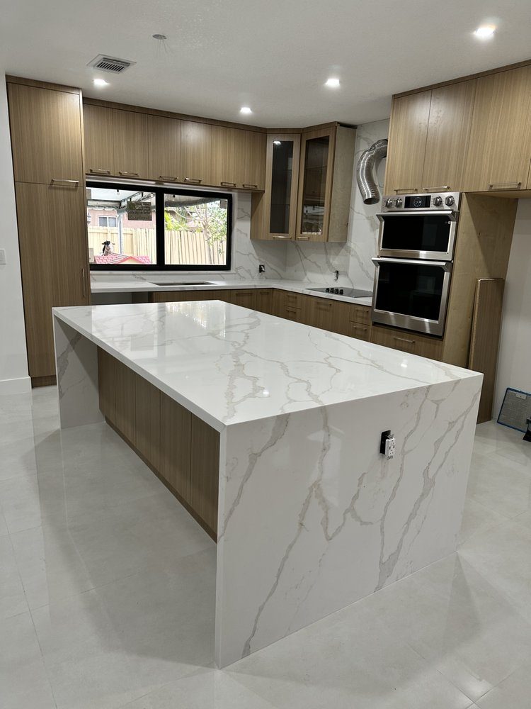 Modern kitchen with a white waterfall island