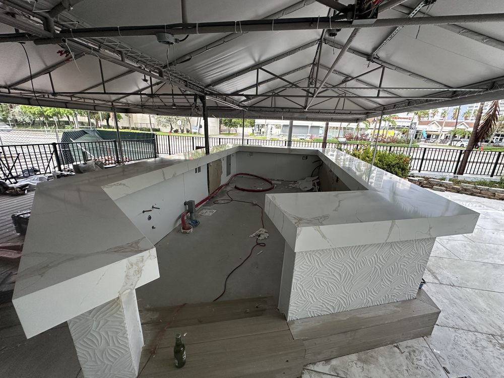 Outdoor bar build with waterfall countertops
