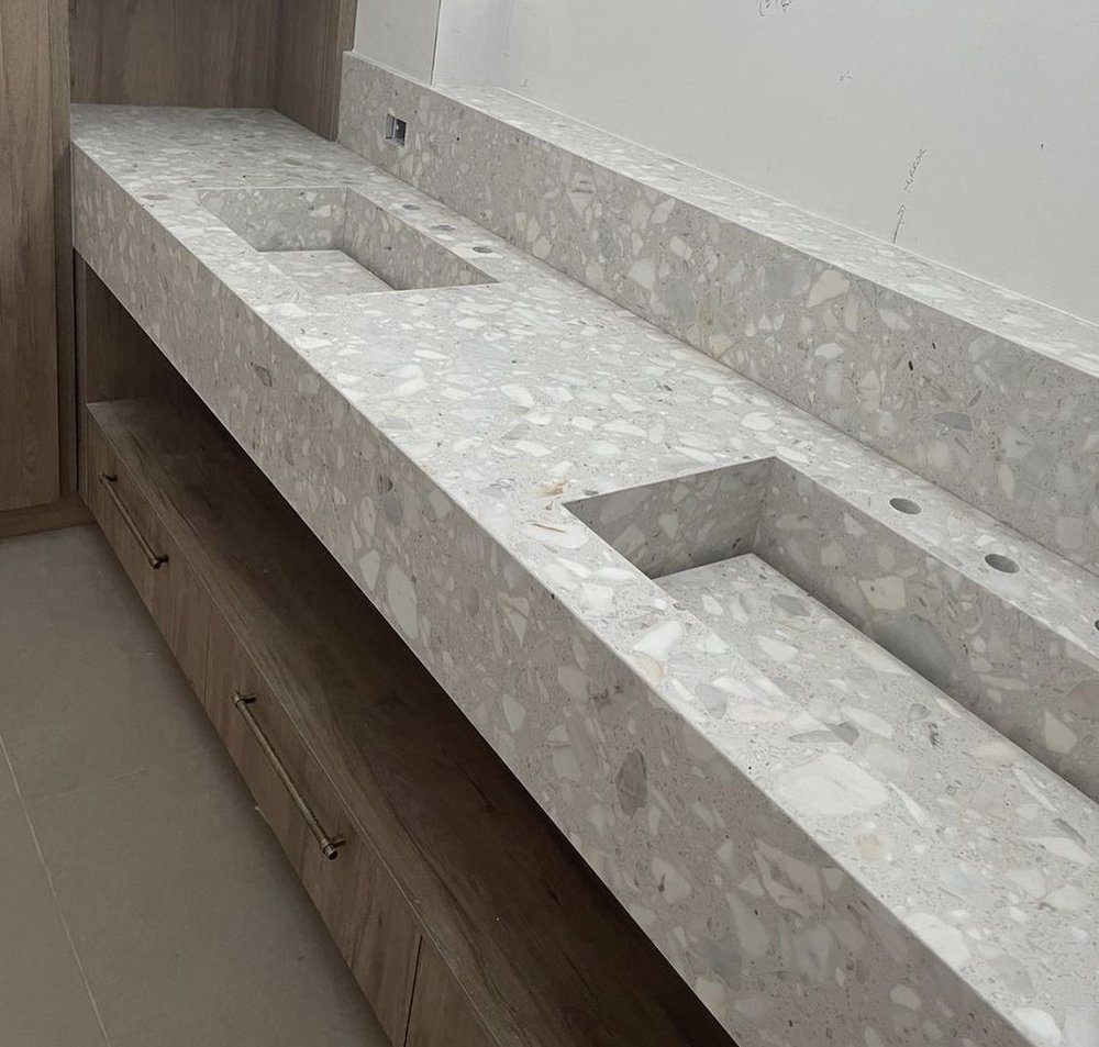 Terrazzo double vanity with custom wood cabinetry